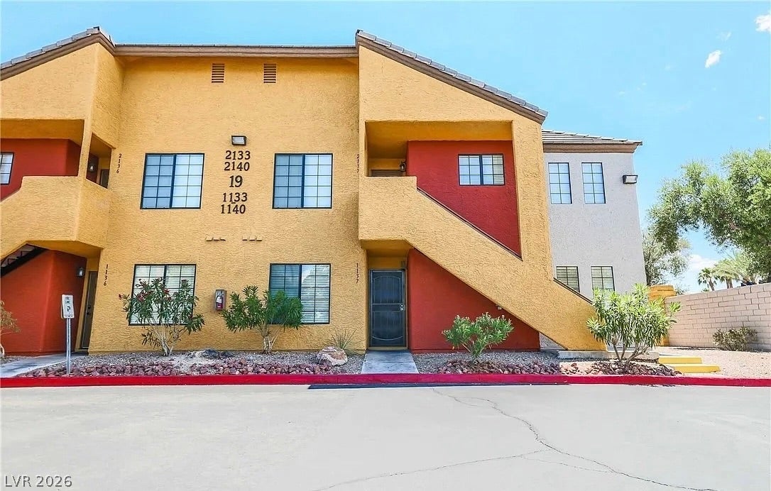 2700 N Rainbow Boulevard, #2137, Las Vegas, NV 89108 Multi-level stucco exterior design highlights this modern residential building entry.