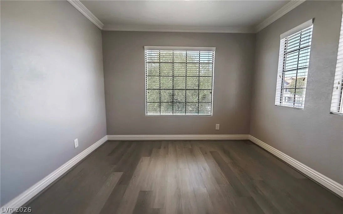 2700 N Rainbow Boulevard, #2137, Las Vegas, NV 89108 Rich wood flooring contrasts beautifully with classic crown molding in this versatile room.