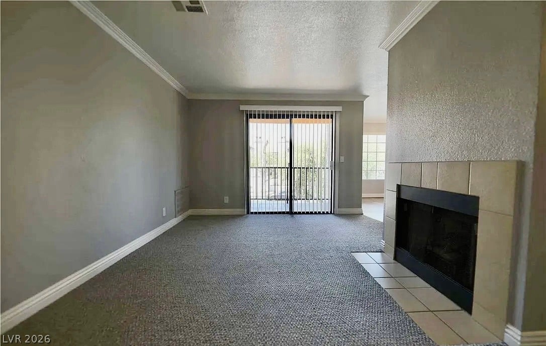 2700 N Rainbow Boulevard, #2137, Las Vegas, NV 89108 An inviting fireplace anchor this comfortable living space, complete with classic crown molding.