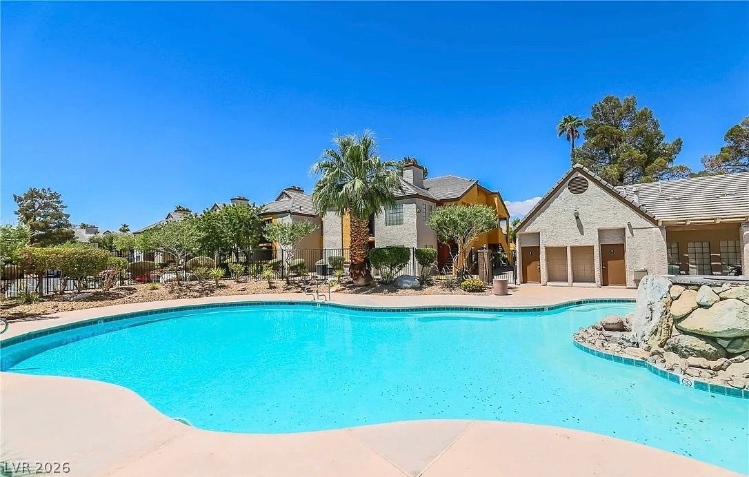 2700 N Rainbow Boulevard, #2137, Las Vegas, NV 89108 An inviting swimming pool serves as the centerpiece of this beautifully landscaped community space.