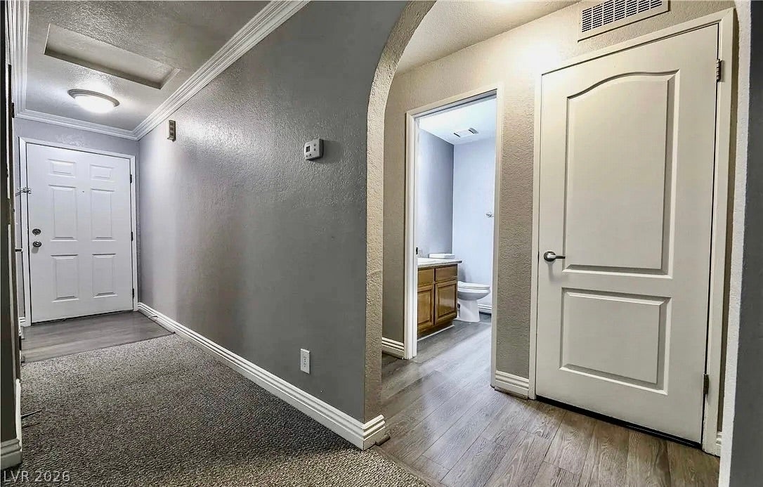 2700 N Rainbow Boulevard, #2137, Las Vegas, NV 89108 An inviting entrance foyer transitions smoothly from soft carpeting to durable wood-look flooring.
