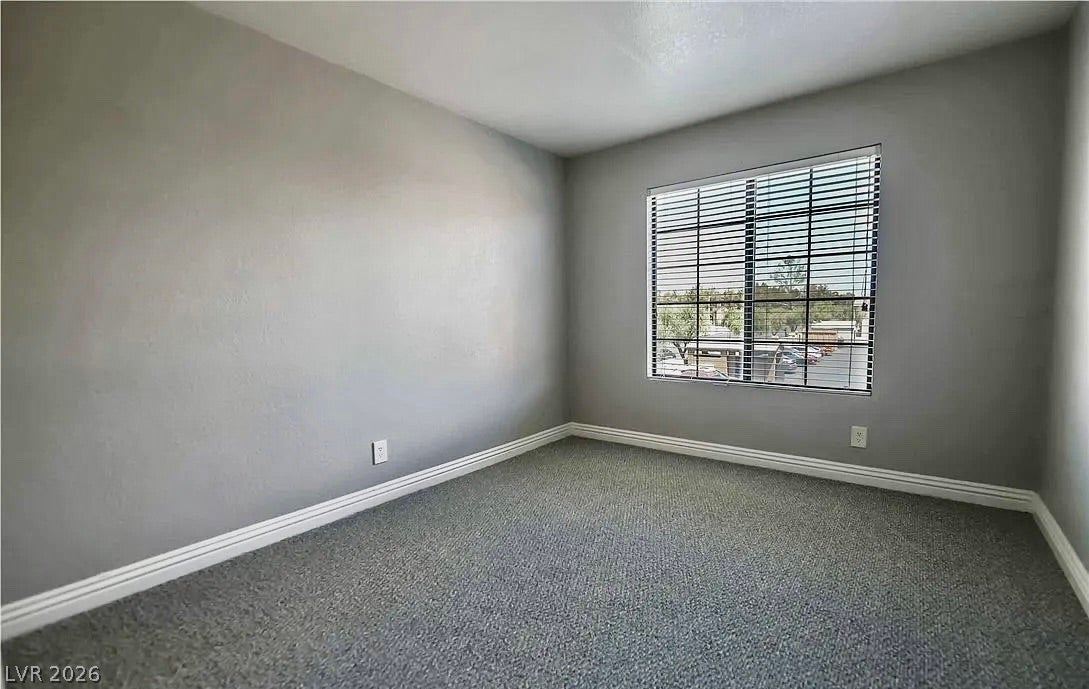 2700 N Rainbow Boulevard, #2137, Las Vegas, NV 89108 Carpeted flooring and a large window facing the neighborhood create a comfortable atmosphere.