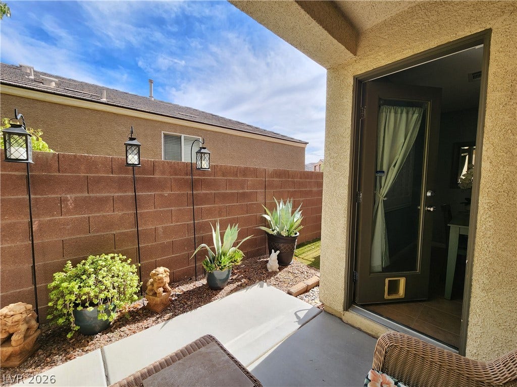 10549 Gibbous Moon Drive, Las Vegas, NV 89129 An inviting covered patio opens directly to a private, low-maintenance outdoor area.