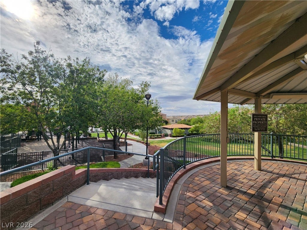 10549 Gibbous Moon Drive, Las Vegas, NV 89129 Stone pavers line a covered viewpoint overlooking the community park and greenbelt.