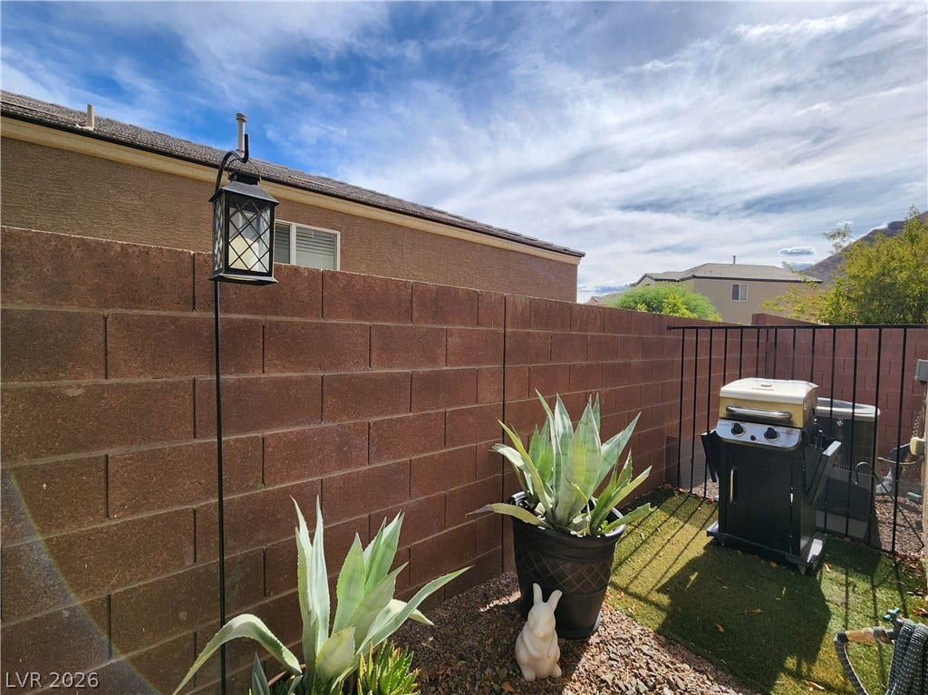 10549 Gibbous Moon Drive, Las Vegas, NV 89129 Secured block walls enclose this private outdoor space under expansive desert skies.