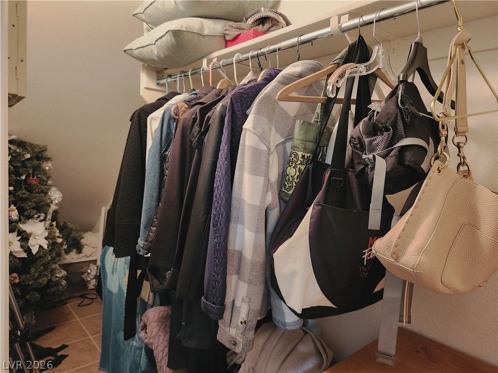 10549 Gibbous Moon Drive, Las Vegas, NV 89129 Ample hanging rods and integrated upper shelving maximize storage within this practical closet space.