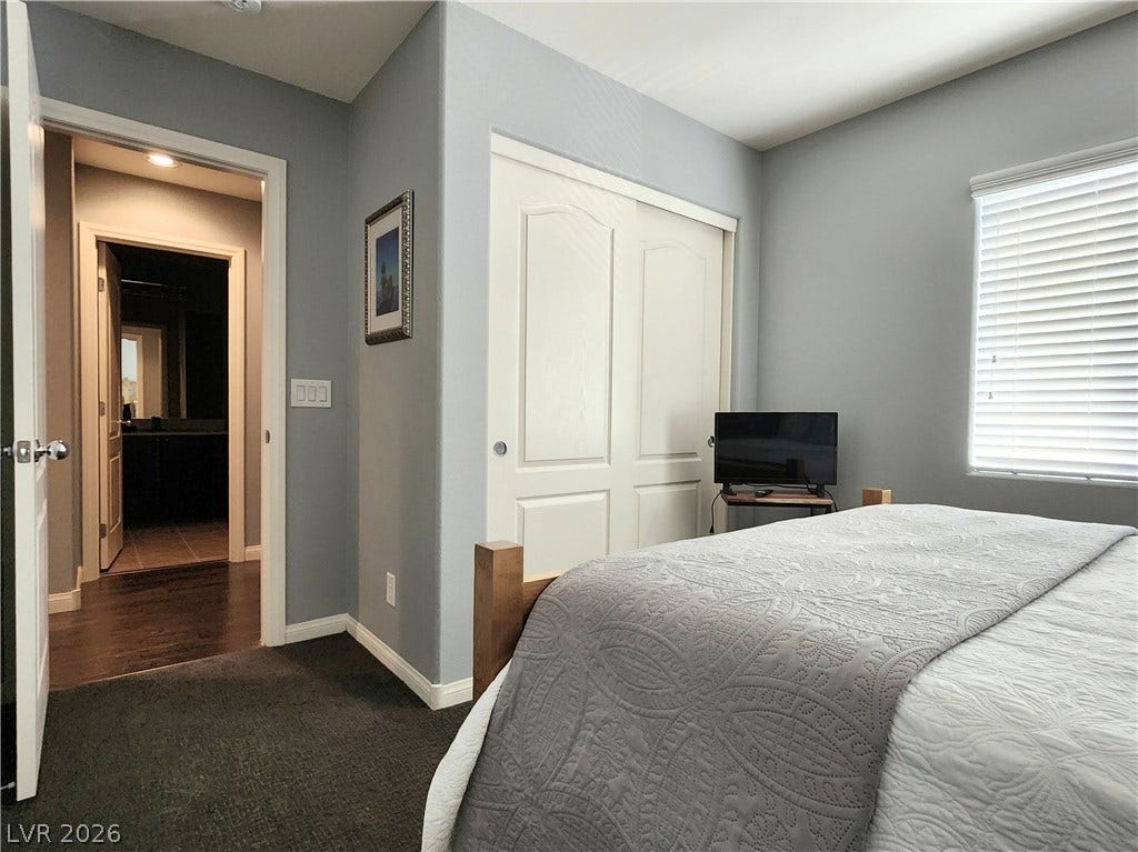 10549 Gibbous Moon Drive, Las Vegas, NV 89129 A quiet bedroom offers wall-to-wall carpeting and a spacious built-in closet.