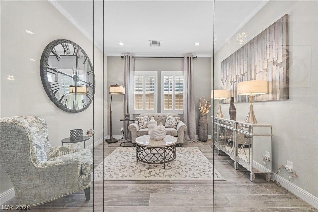 3382 Spring Rock Avenue, Henderson, NV 89044 Gleaming wood-look tile flooring and elegant crown molding define this versatile home office.