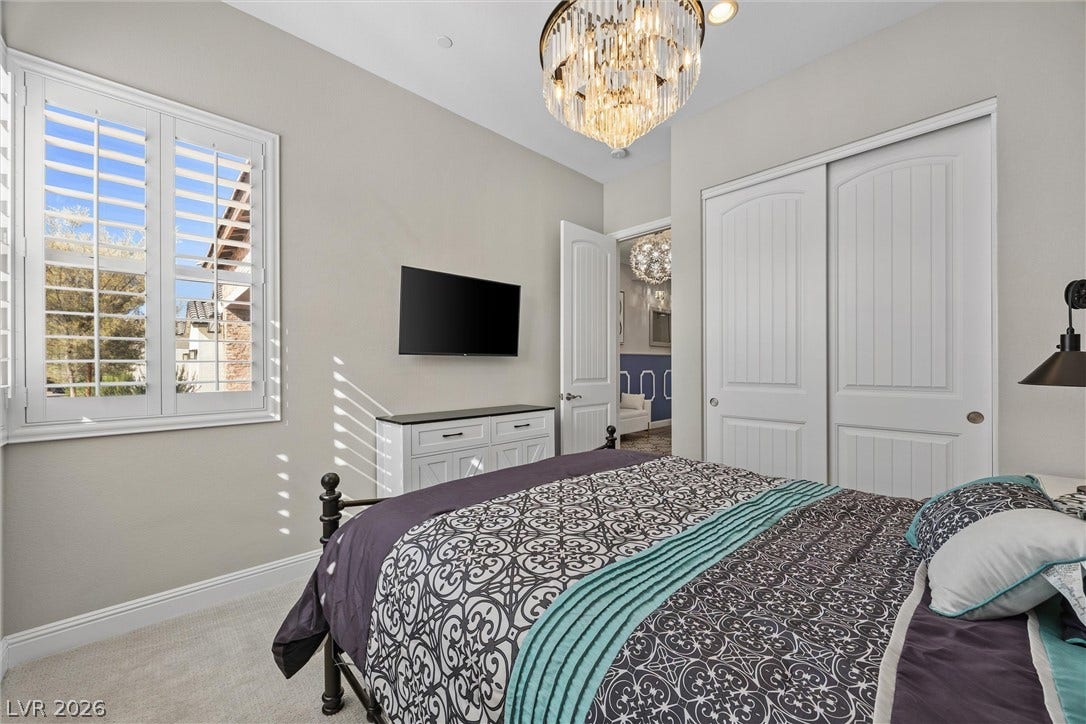 3382 Spring Rock Avenue, Henderson, NV 89044 High ceilings and plantation shutters bring architectural distinction to this comfortable bedroom space.
