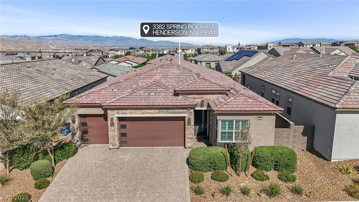 3382 Spring Rock Avenue, Henderson, NV 89044 Stone accents and a tiled roof define the exterior of this single-level home.