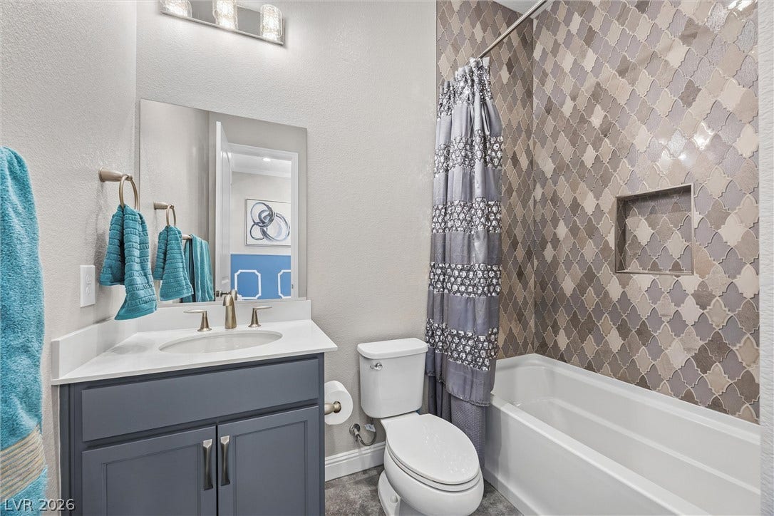 3382 Spring Rock Avenue, Henderson, NV 89044 A stylishly tiled tub surround defines this functional bathroom space.