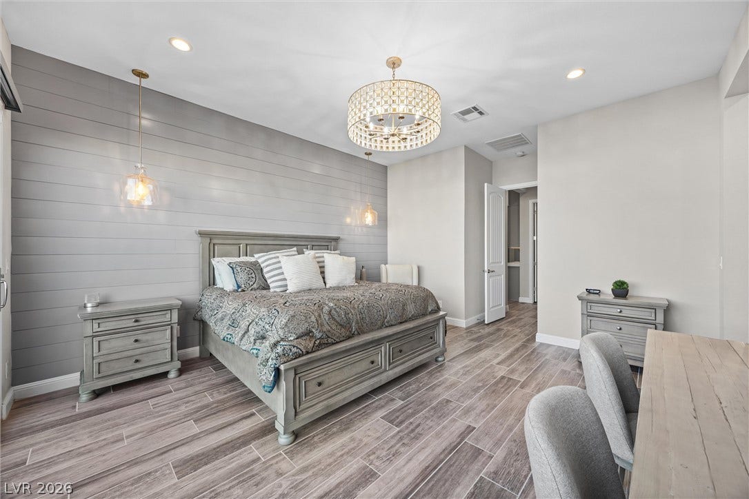 3382 Spring Rock Avenue, Henderson, NV 89044 Shiplap wall detailing and modern tile floors elevate this serene primary retreat.