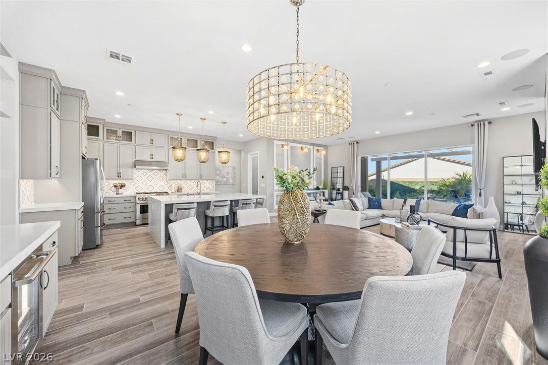 3382 Spring Rock Avenue, Henderson, NV 89044 Gleaming wood-look tile floors stretch across a light-filled, open-concept living and dining layout.