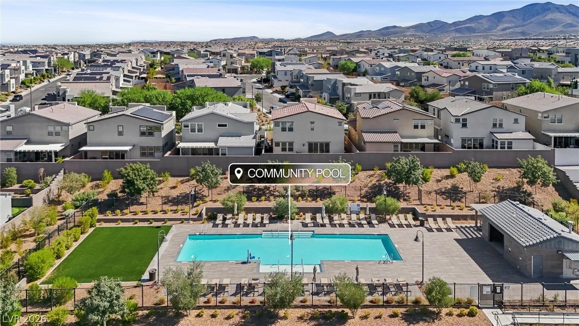 3382 Spring Rock Avenue, Henderson, NV 89044 An inviting community swimming pool is nestled within a landscaped recreation area.