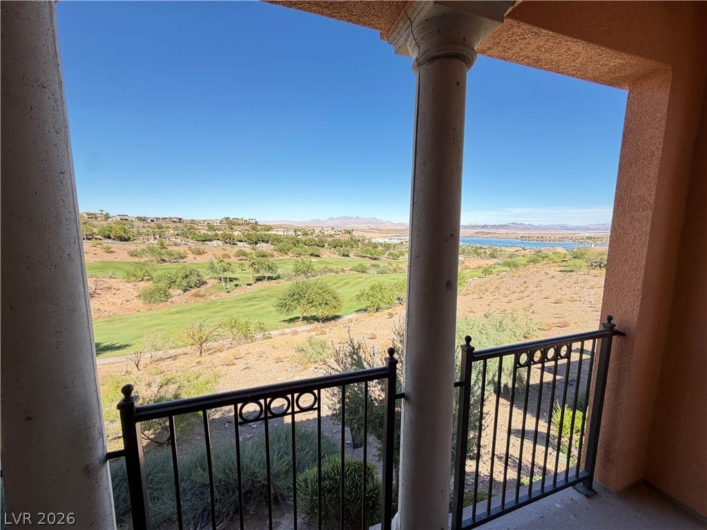 12 Via Visione, #204, Henderson, NV 89011 Sweeping desert, mountain, and golf course vistas open up from a covered balcony space.