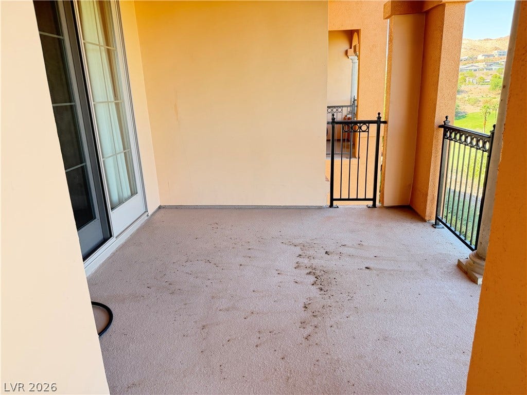 12 Via Visione, #204, Henderson, NV 89011 A spacious covered balcony provides elevated outdoor living space with scenic neighborhood views.