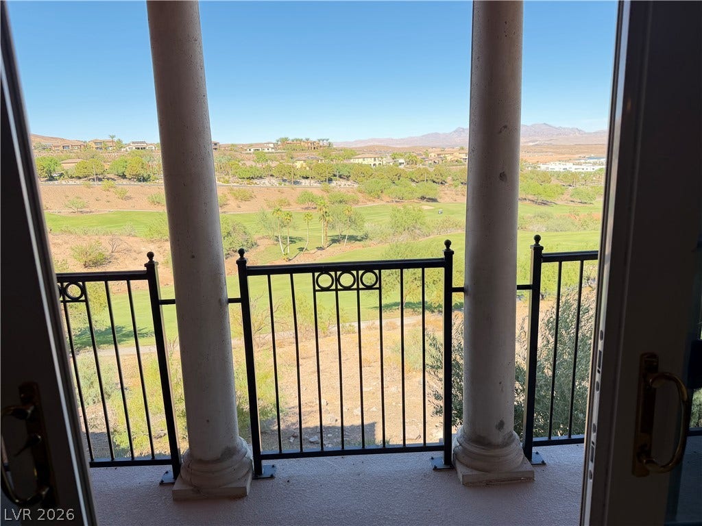 12 Via Visione, #204, Henderson, NV 89011 Sweeping golf course and mountain views unfold from the elevated vantage of a private balcony.