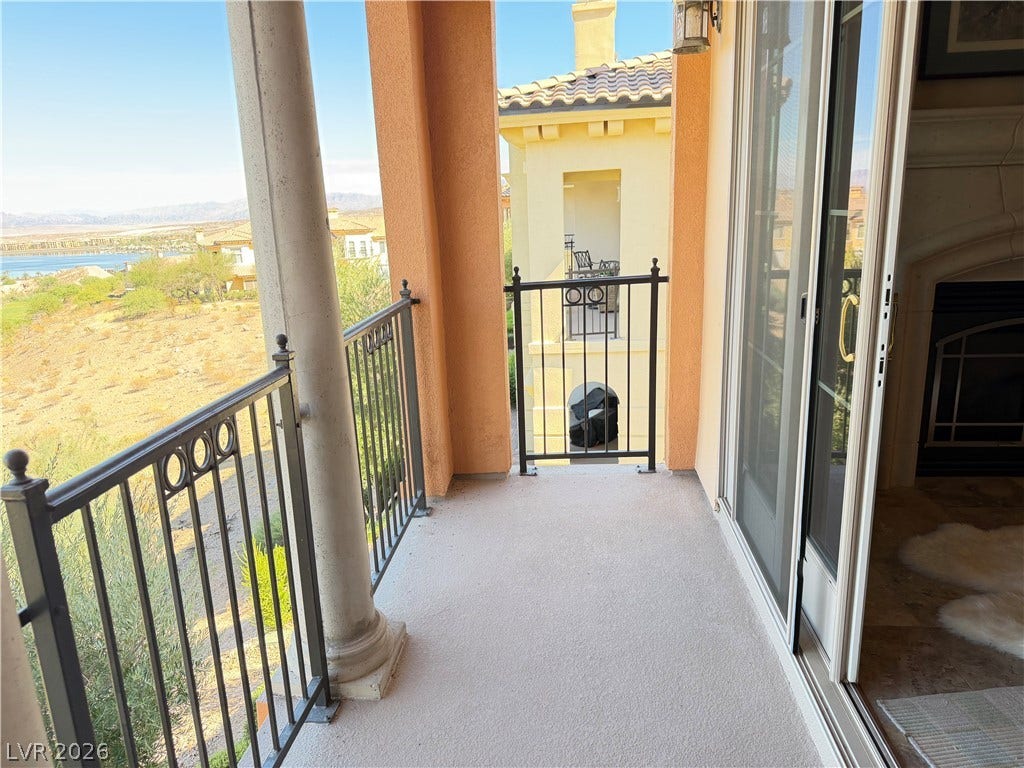 12 Via Visione, #204, Henderson, NV 89011 A private upper-level balcony overlooks sweeping natural desert landscapes and distant water views.