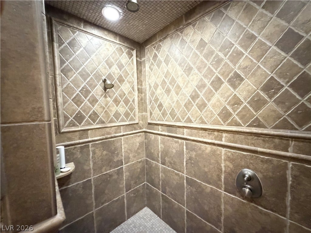 12 Via Visione, #204, Henderson, NV 89011 Detailed tilework lines this walk-in shower from floor to ceiling.