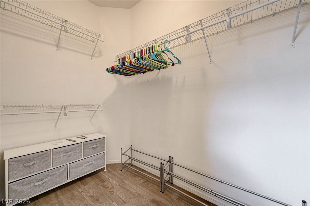 2851 Sapphire Desert Drive, Henderson, NV 89052 Ample wire shelving and wood-look flooring maximize storage in this walk-in closet.