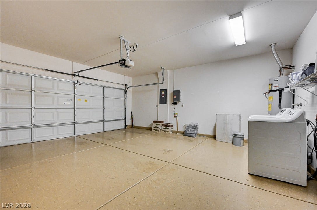 2851 Sapphire Desert Drive, Henderson, NV 89052 An immaculate garage features finished epoxy flooring and built-in laundry connections.