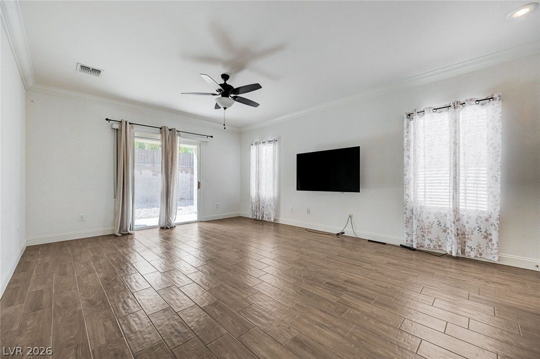 2851 Sapphire Desert Drive, Henderson, NV 89052 Wood-look tile flooring and crown molding define this open, airy living space.