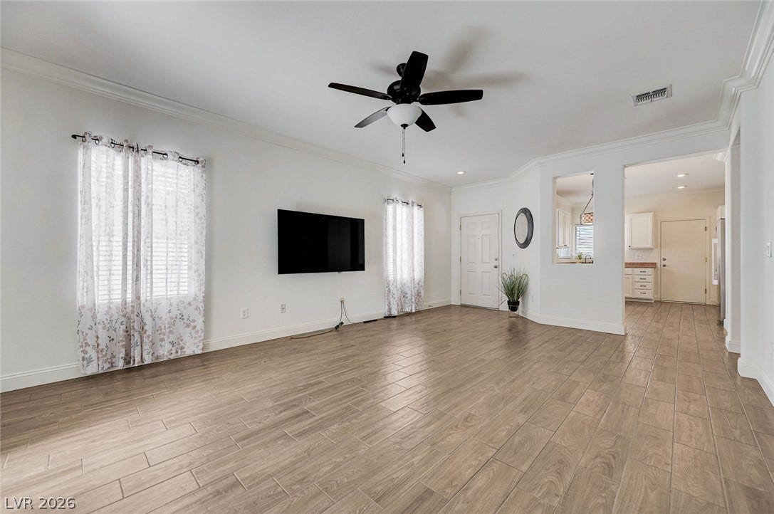 2851 Sapphire Desert Drive, Henderson, NV 89052 An open layout flows seamlessly across wood-look tile flooring.