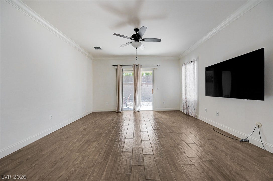 2851 Sapphire Desert Drive, Henderson, NV 89052 Gleaming tile floors and crisp crown molding highlight this versatile living area.