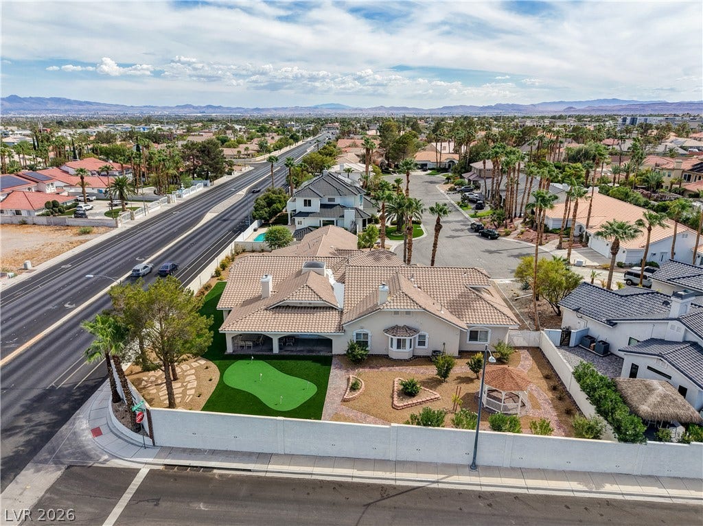2000 Alexa Breanne Court, Las Vegas, NV 89117 An aerial perspective showcases the tiled roofline and the sprawling backyard putting green.