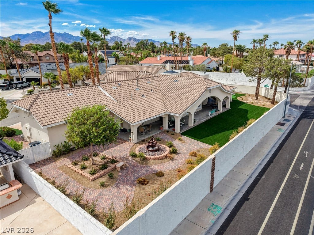 2000 Alexa Breanne Court, Las Vegas, NV 89117 An aerial view showcases a Spanish-tile roof, expansive paved patios, and a manicured landscape.