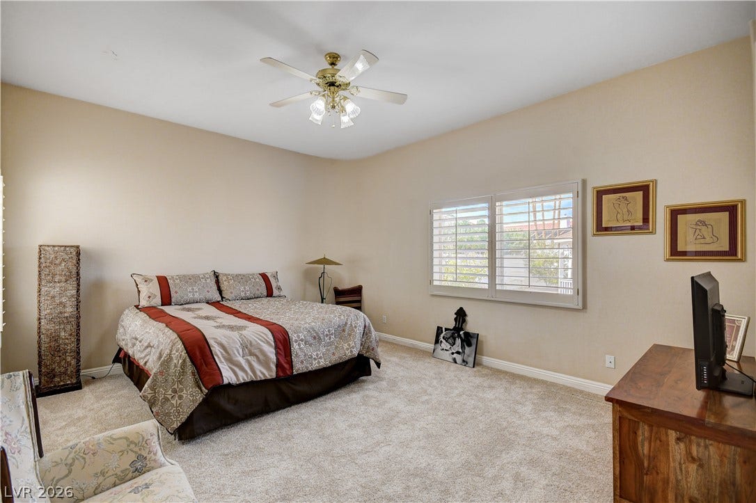2000 Alexa Breanne Court, Las Vegas, NV 89117 Plush carpeting and custom plantation shutters define this comfortable and inviting bedroom retreat.