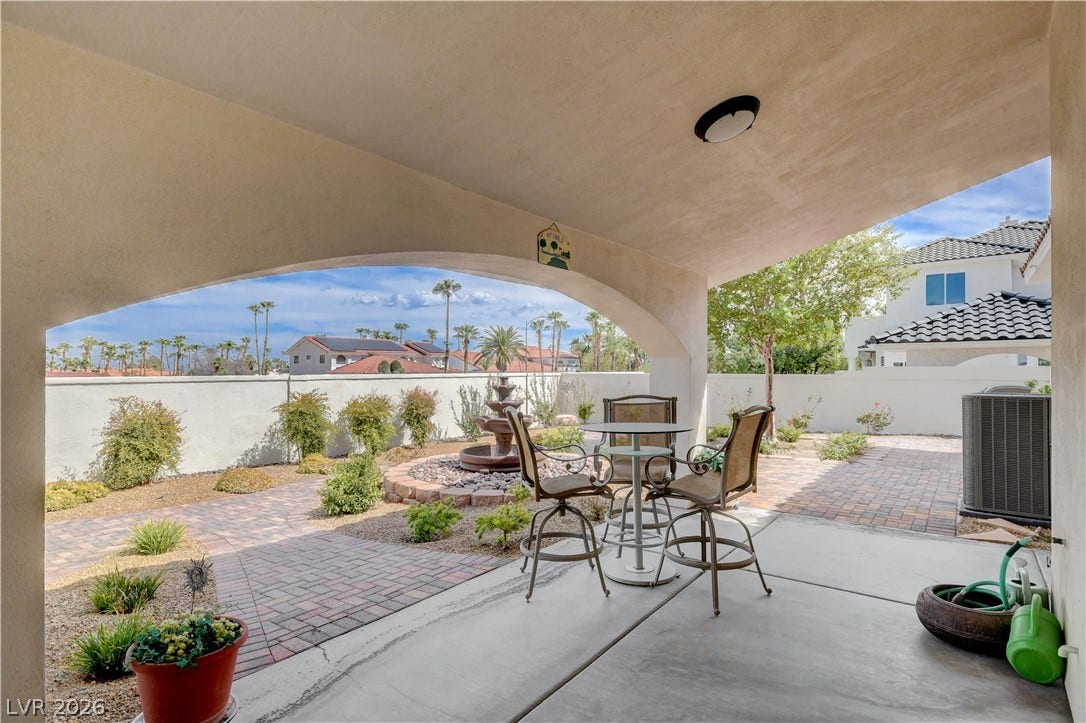 2000 Alexa Breanne Court, Las Vegas, NV 89117 Shaded concrete patio overlooks a beautifully landscaped courtyard with brick paved pathways.