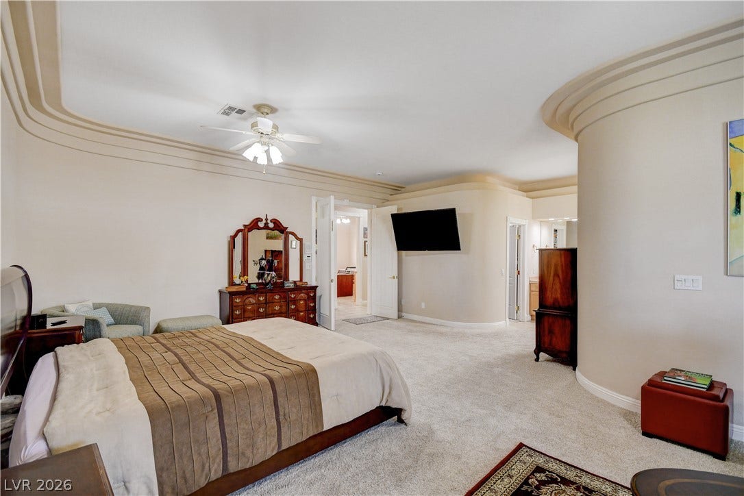 2000 Alexa Breanne Court, Las Vegas, NV 89117 Distinctive curved walls and multi-tier crown molding elevate this spacious master suite.
