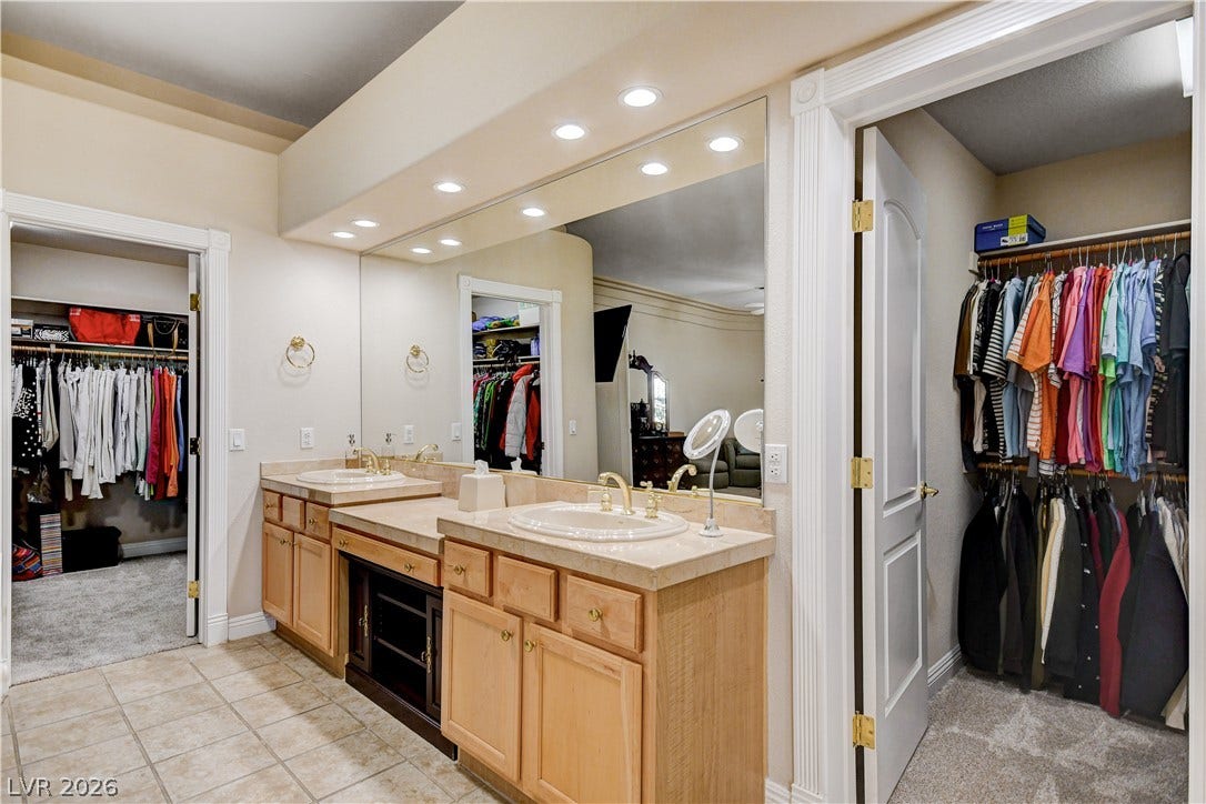 2000 Alexa Breanne Court, Las Vegas, NV 89117 Double vanities with ample counter space sit adjacent to a spacious walk-in closet.