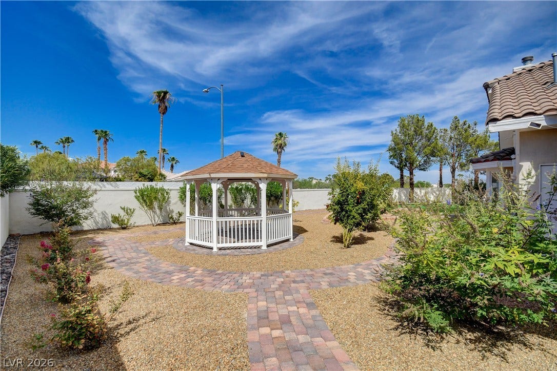 2000 Alexa Breanne Court, Las Vegas, NV 89117 A charming gazebo centers the low-maintenance yard complete with curved paver walkways.
