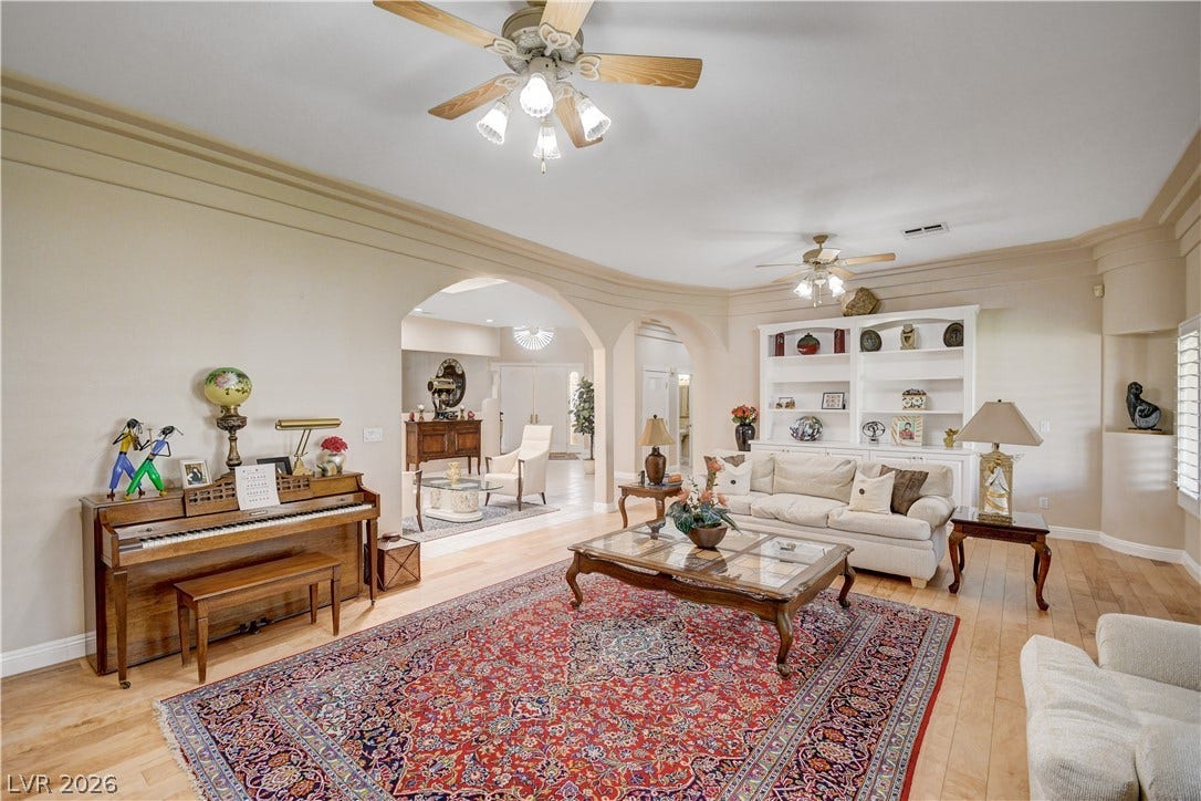 2000 Alexa Breanne Court, Las Vegas, NV 89117 Hardwood floors and classic crown molding accent this welcoming living space.