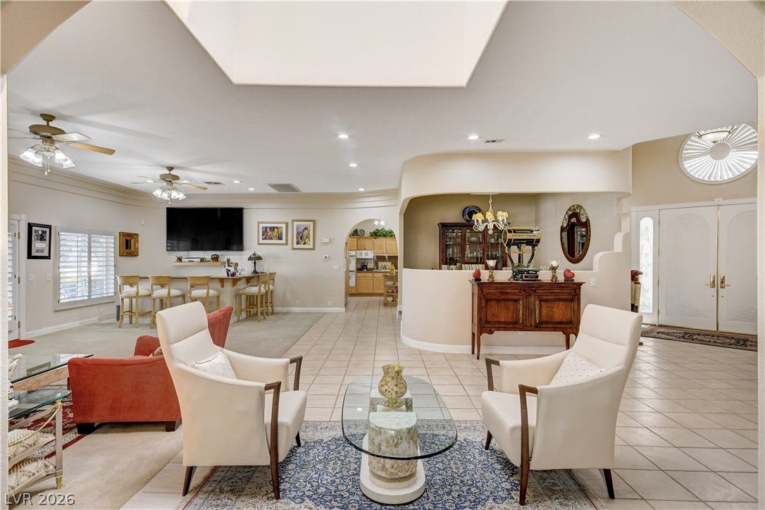 2000 Alexa Breanne Court, Las Vegas, NV 89117 An open floorplan connects the central living spaces under vaulted ceilings and skylights.