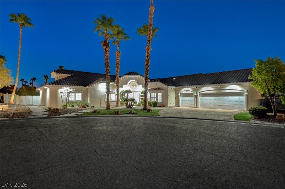 2000 Alexa Breanne Court, Las Vegas, NV 89117 Manicured landscaping and soaring palm trees frame the exterior of this custom estate.