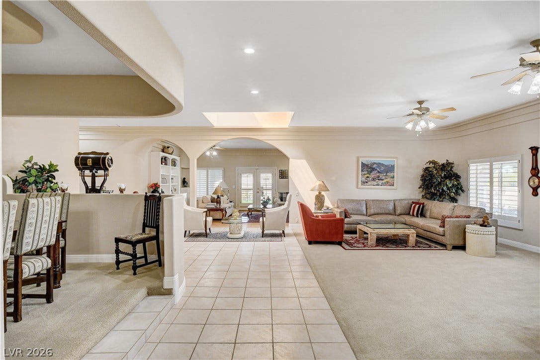 2000 Alexa Breanne Court, Las Vegas, NV 89117 An open floorplan connects the tile-floored entryway directly into a carpeted living space.
