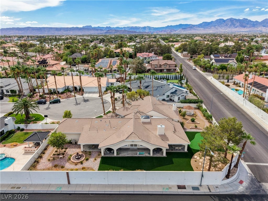 2000 Alexa Breanne Court, Las Vegas, NV 89117 Majestic mountain peaks form a scenic backdrop for this expansive corner-lot property.