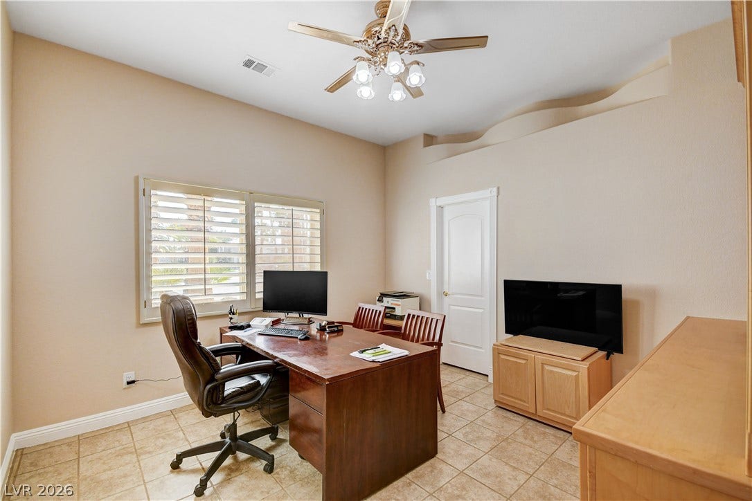 2000 Alexa Breanne Court, Las Vegas, NV 89117 Tiled flooring and high ceilings with decorative architectural detailing define this versatile workspace.