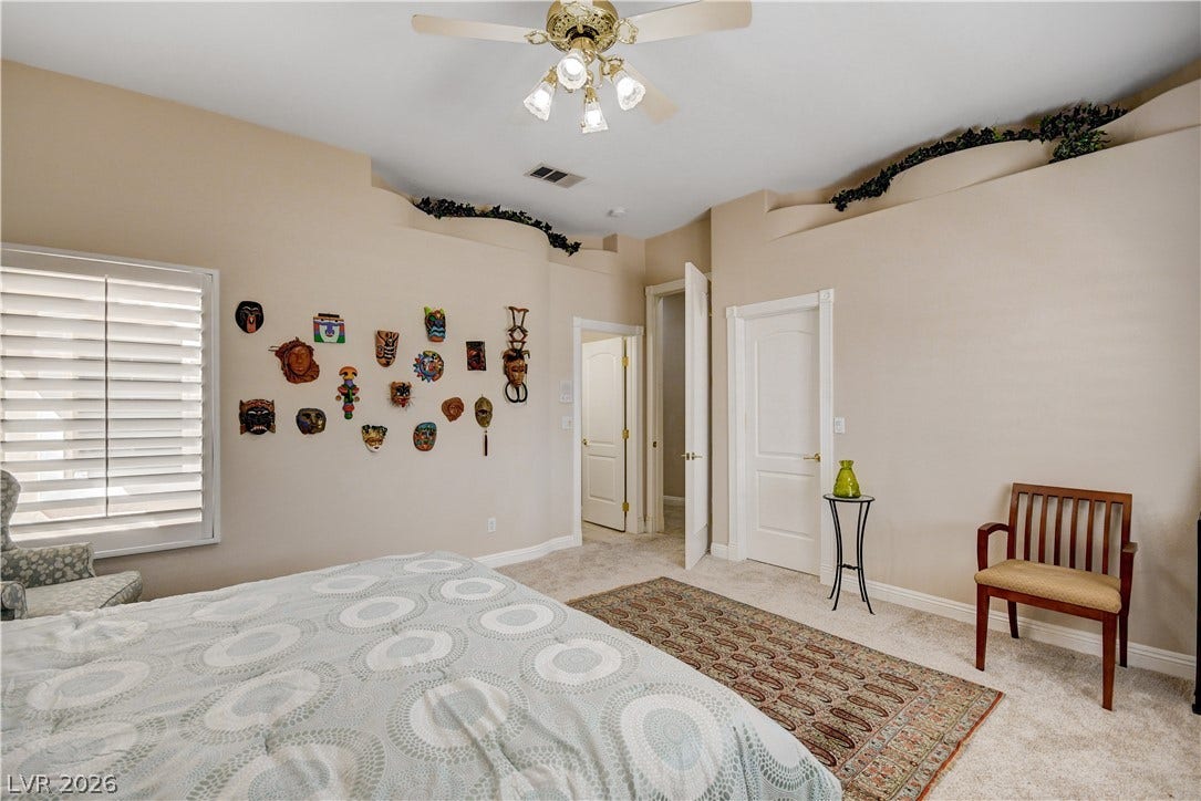 2000 Alexa Breanne Court, Las Vegas, NV 89117 High ceilings and tall doors create an airy atmosphere in this bedroom.