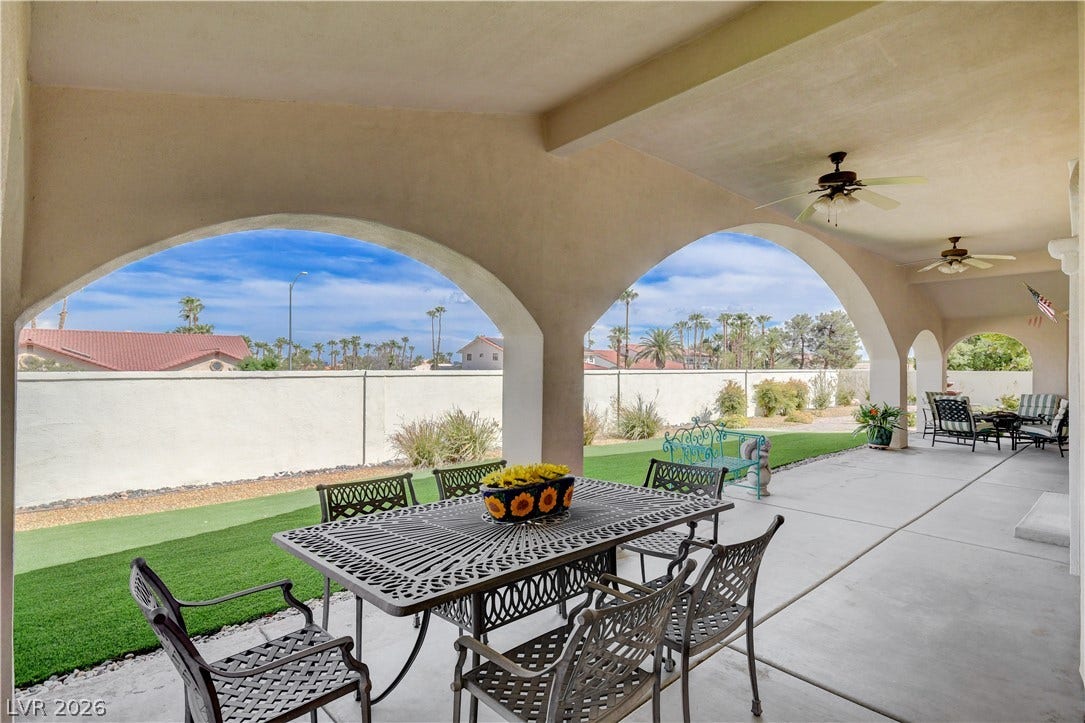2000 Alexa Breanne Court, Las Vegas, NV 89117 Arched openings frame views of the private yard from a sheltered concrete patio.