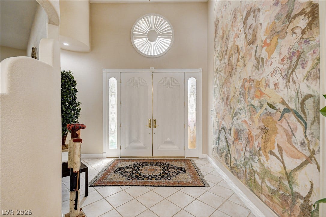 2000 Alexa Breanne Court, Las Vegas, NV 89117 Double doors open into a bright entrance foyer featuring high ceilings and tile flooring.