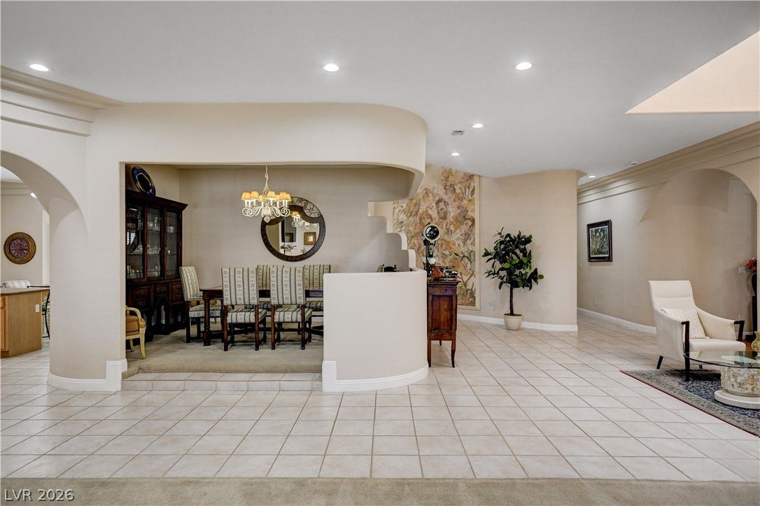 2000 Alexa Breanne Court, Las Vegas, NV 89117 Smooth architectural arches and tiled floors define this open interior space.