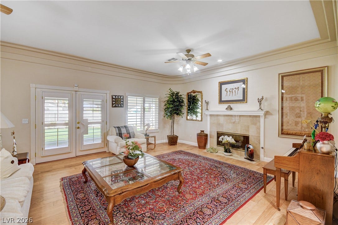 2000 Alexa Breanne Court, Las Vegas, NV 89117 Hardwood floors and a classic fireplace warm this inviting living room.
