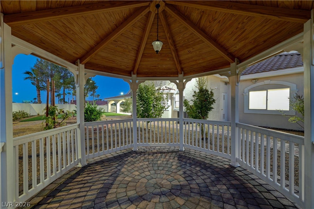 2000 Alexa Breanne Court, Las Vegas, NV 89117 An elegant backyard gazebo features a vaulted wood-lined ceiling and classic paver stone flooring.