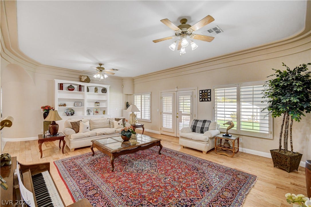 2000 Alexa Breanne Court, Las Vegas, NV 89117 Rich wood flooring and elegant crown molding define this welcoming living space.