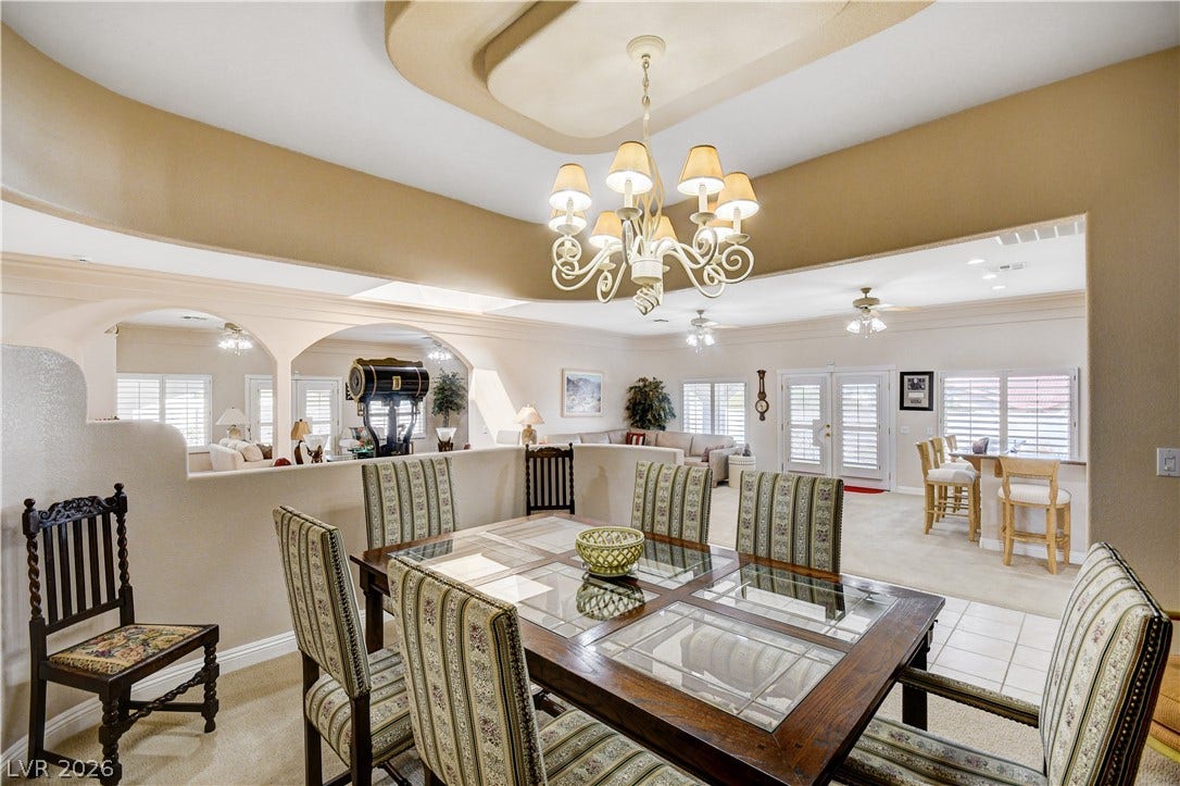 2000 Alexa Breanne Court, Las Vegas, NV 89117 An elegant tray ceiling and classic arched transitions define this formal dining space.
