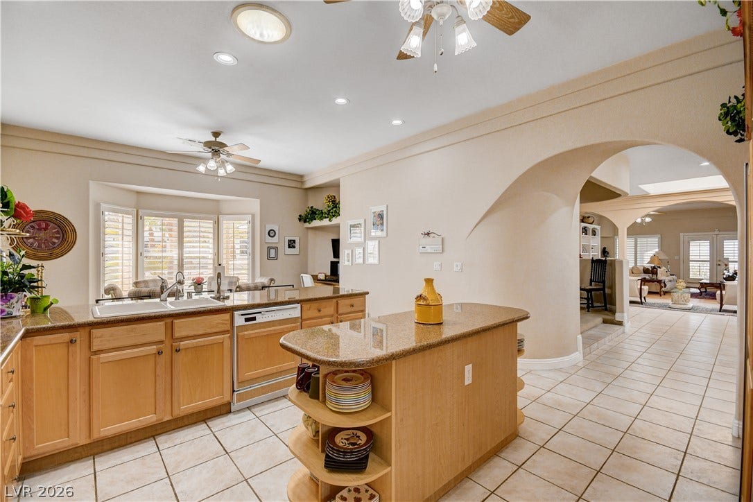 2000 Alexa Breanne Court, Las Vegas, NV 89117 An arched architectural passageway complements the tile flooring and spacious open layout.